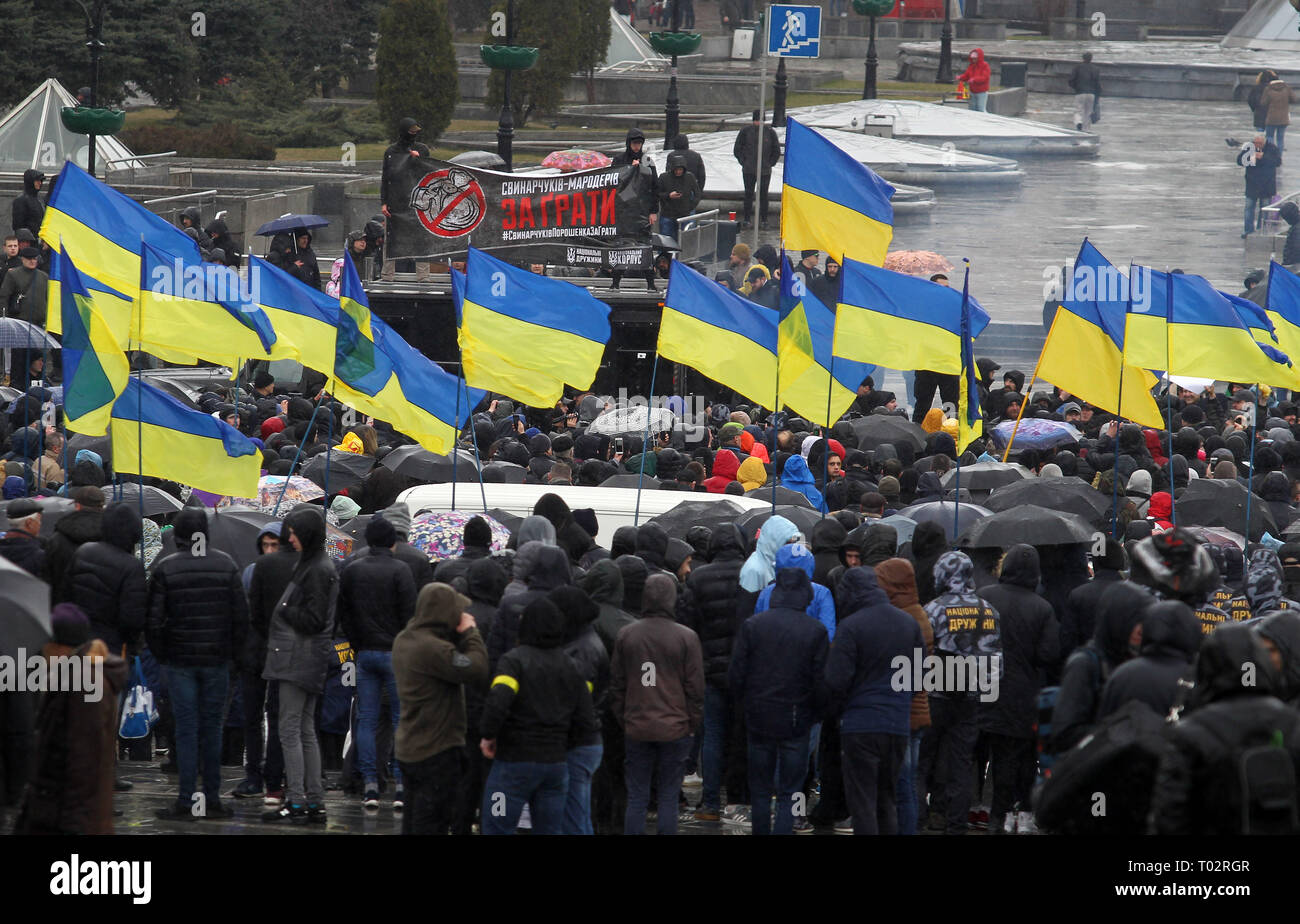 Kiev, Ukraine. 16th March 2019. Nationalists are seen holding flags during the protest. Protest against corruption in the country's defence industry in Kiev, Ukraine. Activists and supporters of 'National Corps' Ukrainian nationalist party demand for arrests of the top figures in an alleged military corruption scandal, which they were accused of profiting from the sale to state defence companies at inflated prices of smuggled Russian military parts. Credit: SOPA Images Limited/Alamy Live News Credit: SOPA Images Limited/Alamy Live News Stock Photo