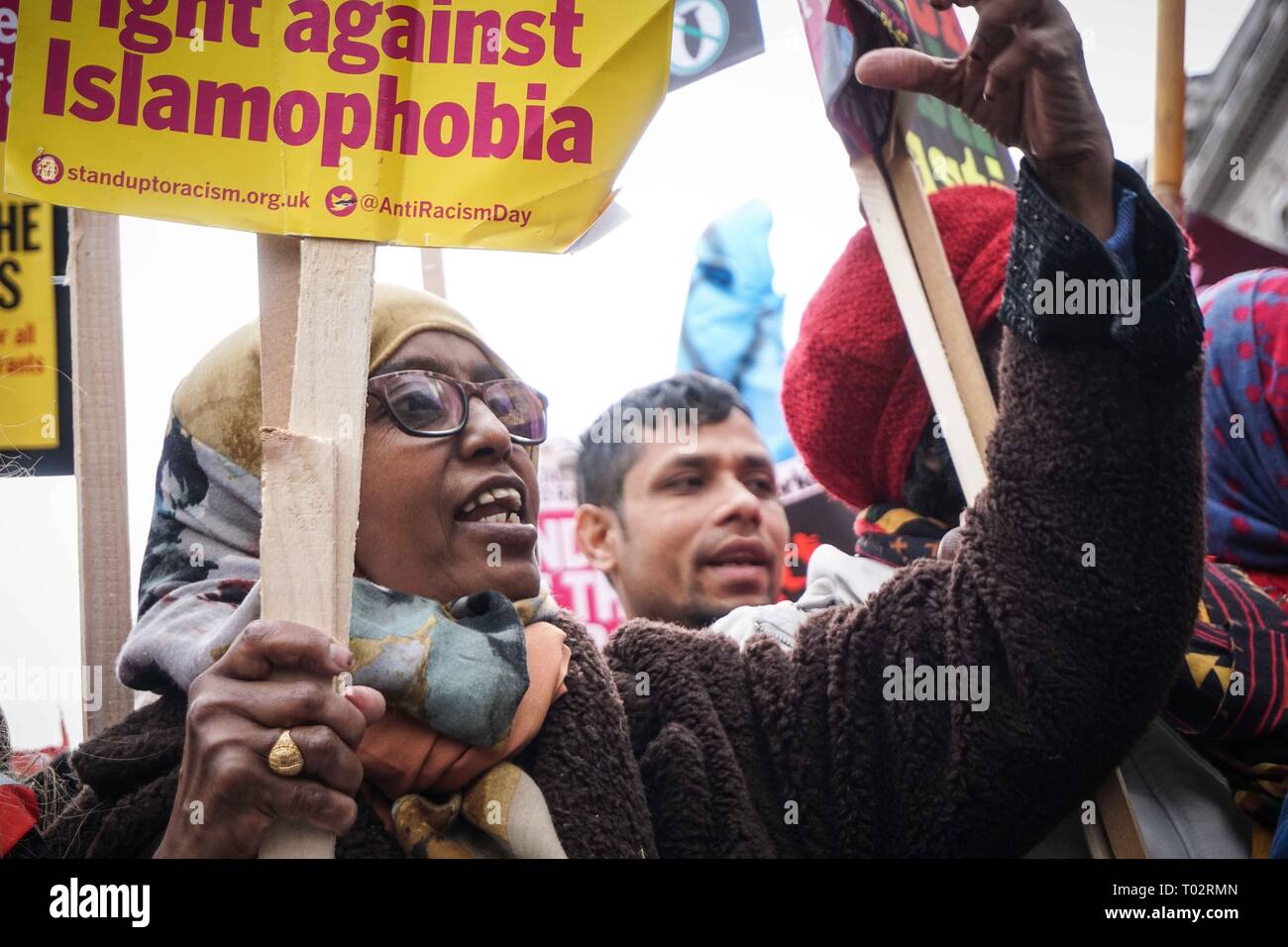 London, UK. 16th March 2019. A protester seen shouting slogans while holding a placard during an anti racist demonstration. Thousands of anti-racists groups took to the streets marking the World against Racism global day of action. Credit: SOPA Images Limited/Alamy Live News Stock Photo