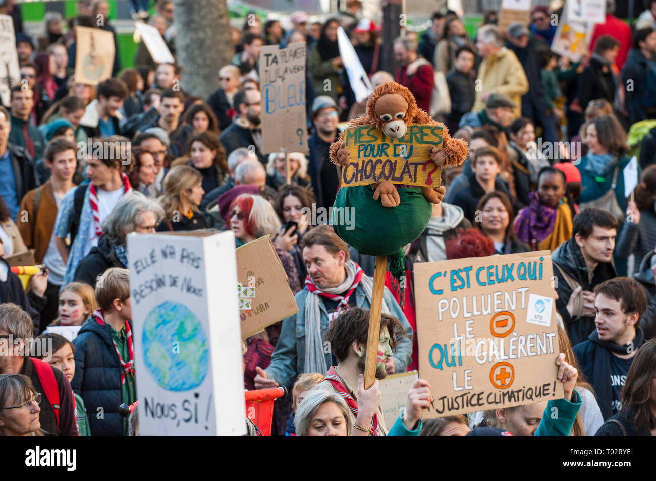 Paris, France. 16th March 2019. Protesters seen holding several placards during the March of The Century strike in Paris. Thousands of people demonstrated in the streets of Paris to denounce the inaction of the government about the climate change during a march called 'March of The Century' (La Marche du Siecle). Credit: SOPA Images Limited/Alamy Live News Stock Photo