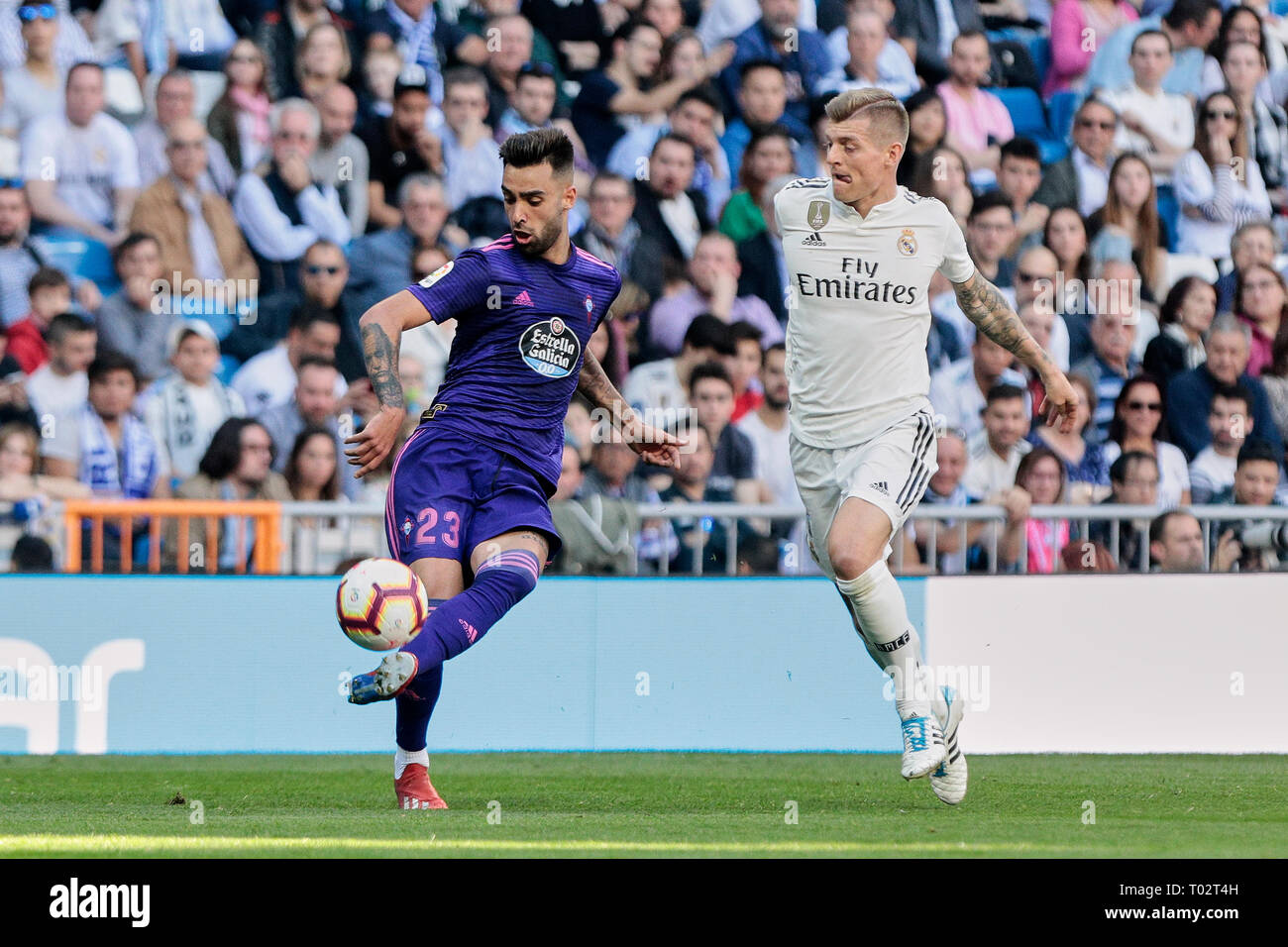 Madrid, Spain. 16th March 2019. Real Madrid's Toni Kroos and Real Club Celta de Vigo's Brais Mendez seen in action during La Liga match between Real Madrid and Real Club Celta de Vigo at Santiago Bernabeu Stadium in Madrid, Spain. Credit: SOPA Images Limited/Alamy Live News Stock Photo