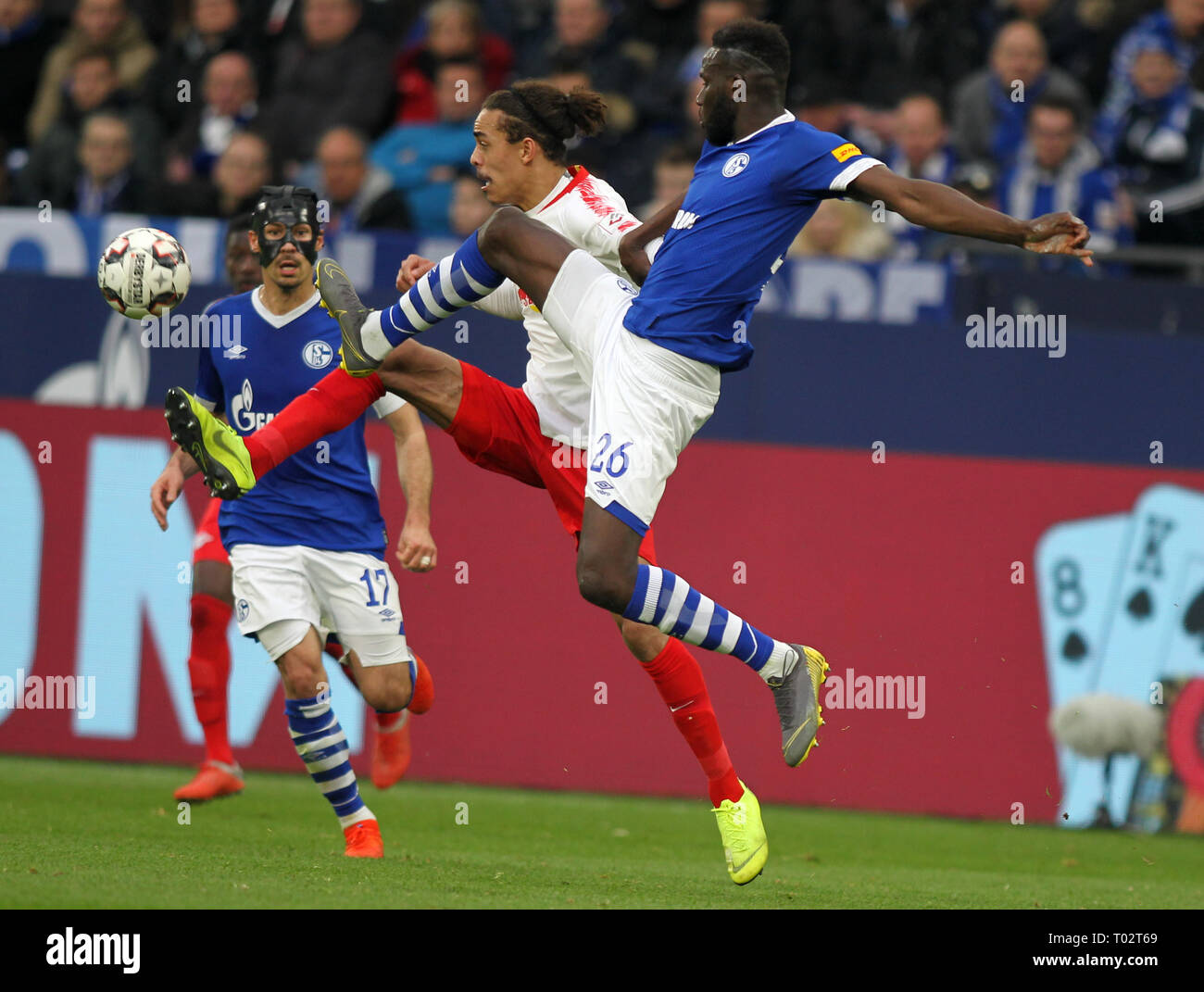 Gelsenkirchen, Germany. 16th March 2019. Salif Sane of Schalke 04, right, and Yussuf Poulsen of RB Leipzig are seen in action during the German Bundesliga soccer match between FC Schalke 04 and RB Leipzig in Gelsenkirchen. ( Final score; FC Schalke 0:1 RB Leipzig) Credit: SOPA Images Limited/Alamy Live News Stock Photo