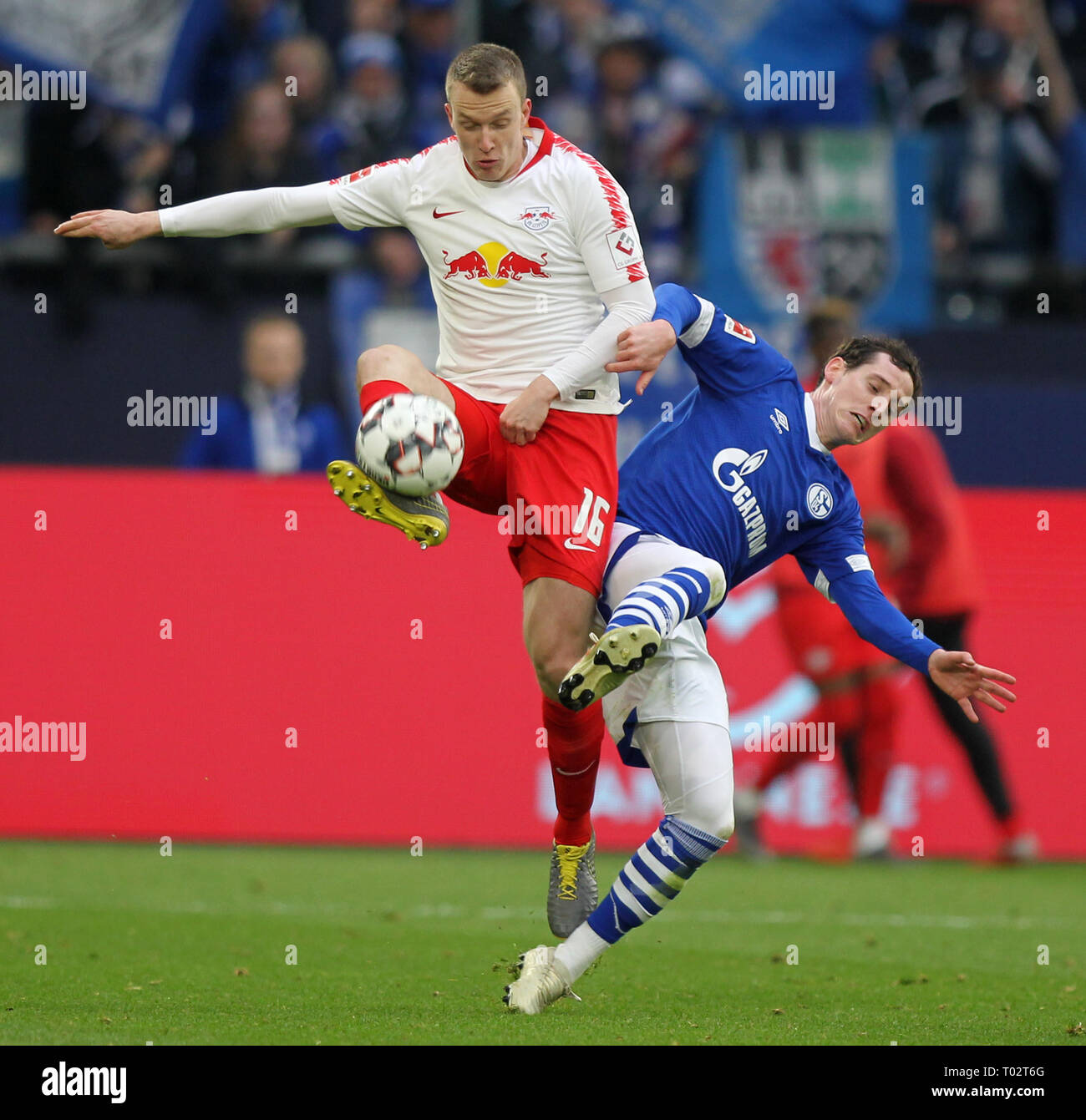 Gelsenkirchen, Germany. 16th March 2019. Sebastian Rudy of Schalke 04, right, and Lukas Klostermann of RB Leipzig are seen in action during the German Bundesliga soccer match between FC Schalke 04 and RB Leipzig in Gelsenkirchen. ( Final score; FC Schalke 0:1 RB Leipzig) Credit: SOPA Images Limited/Alamy Live News Stock Photo