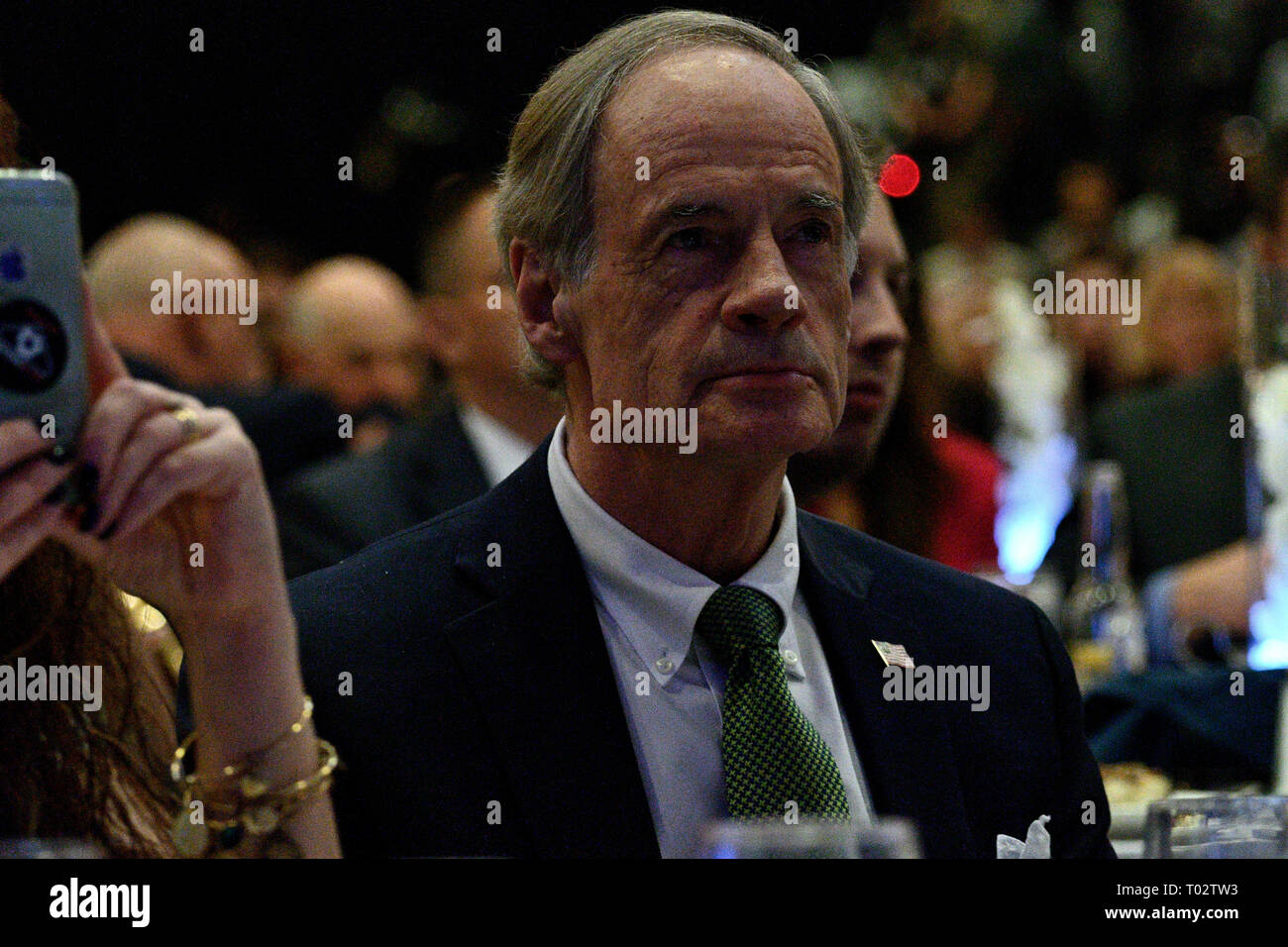 Delaware, USA. 16th March 2019. Sen. Tom Carper listens as Joe Biden delivers the keynote speech at the First State Democratic Dinner at the Rollins Center in Dover, DE on March 16, 2019. The former U.S. Vice President refrained from announcing his candidacy, even-though early polls conducted in March indicate former Vice President Biden as the favorite of a large Democratic field of candidates. Credit: OOgImages/Alamy Live News Stock Photo