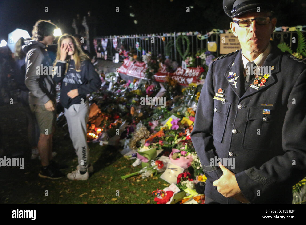 Christchurch, New Zealand. 16th March 2019. A Police officer seen at the tribute of the Christchurch mosques shooting. Around 50 people has been reportedly killed in the Christchurch mosques terrorist attack shooting targeting the Masjid Al Noor Mosque and the Linwood Mosque. Credit: SOPA Images Limited/Alamy Live News Stock Photo