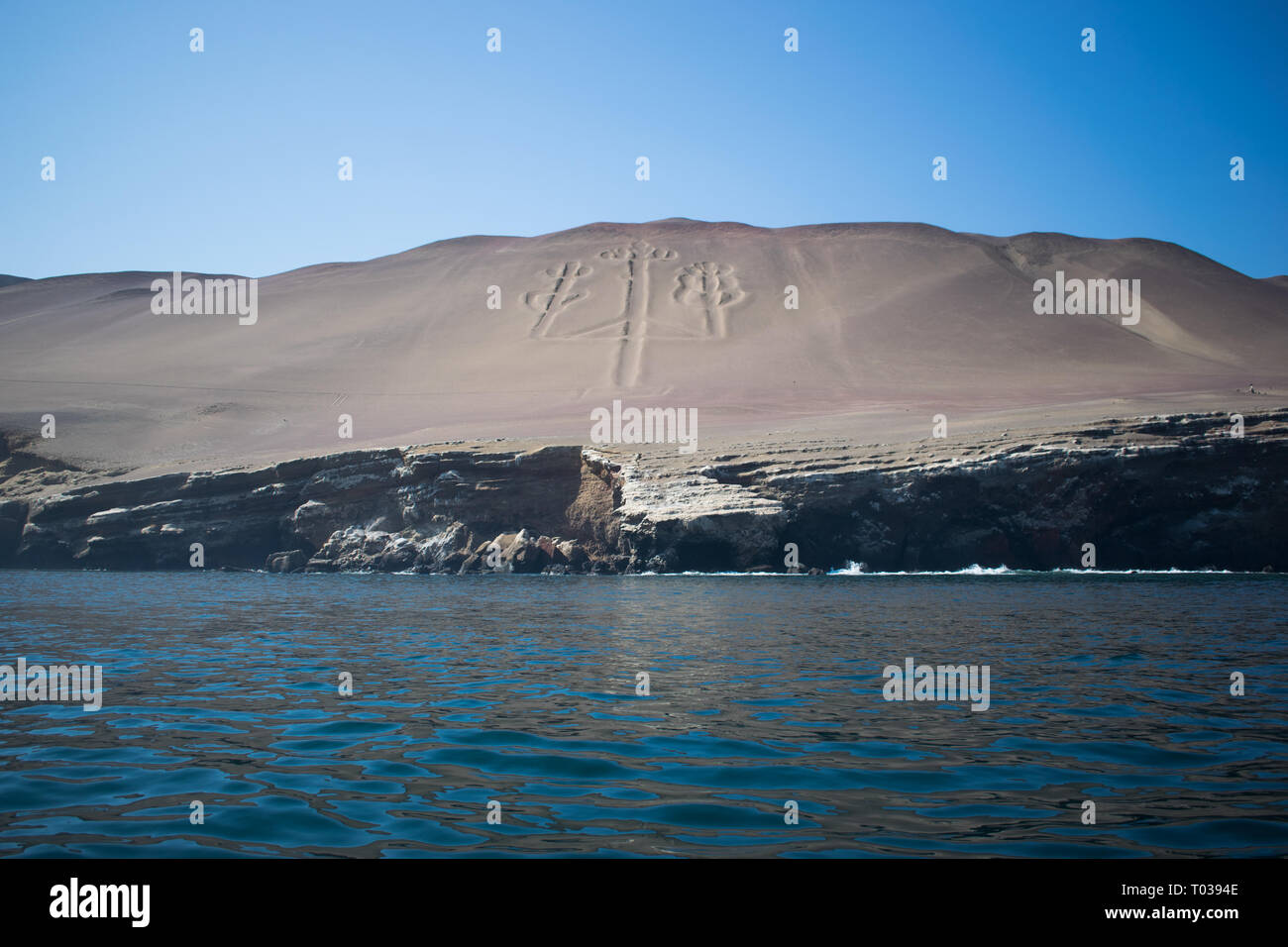 The Candelabra, located in Paracas, Peru, is a famous prehistoric geoglyph dating back to 200 BCE. Stock Photo