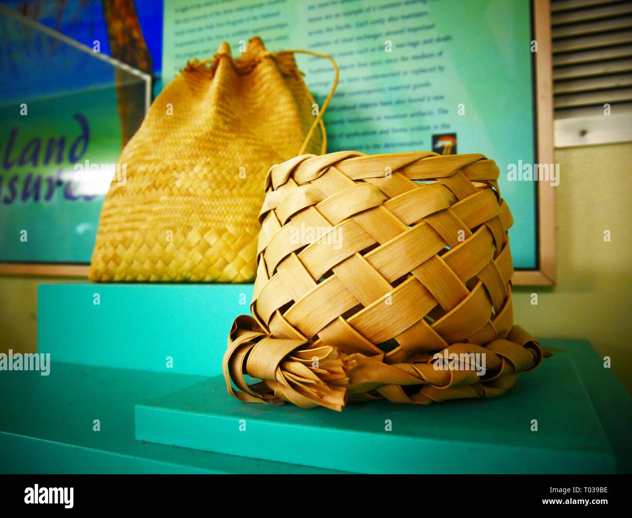 Basket bag made of woven coconut leaves on display at a shelf Stock