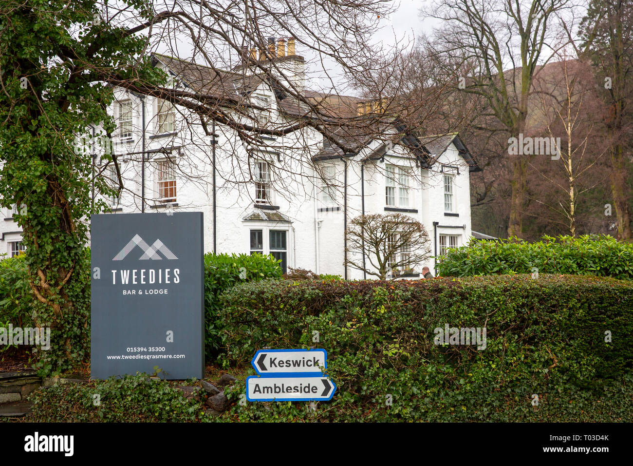 Tweedies country house hotel and lodge in Grasmere,Lake District national park,Cumbria,England with road signs to locall towns Stock Photo