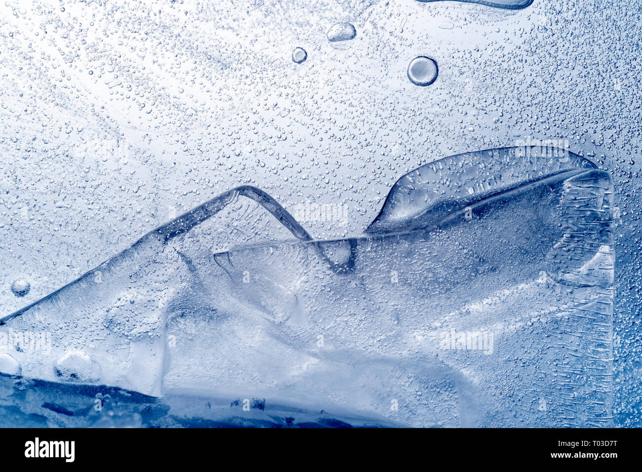 Abstract background of slabs of ice with many air bubbles. Stock Photo