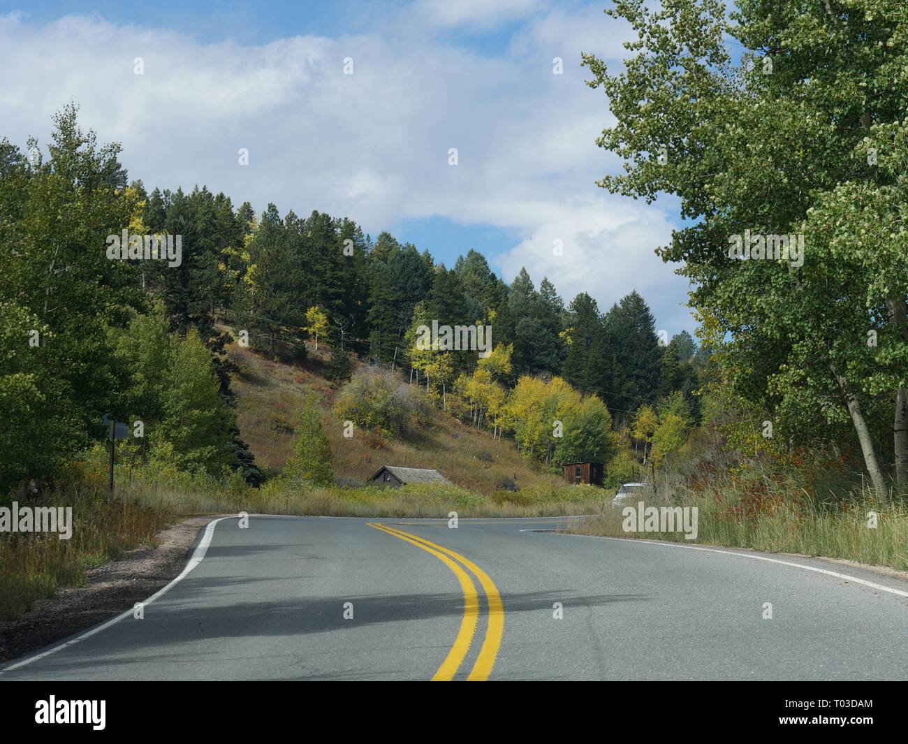 Winding roads with cabins by the roadside at the Golden Gate Canyon State Park in Golden, Colorado Stock Photo