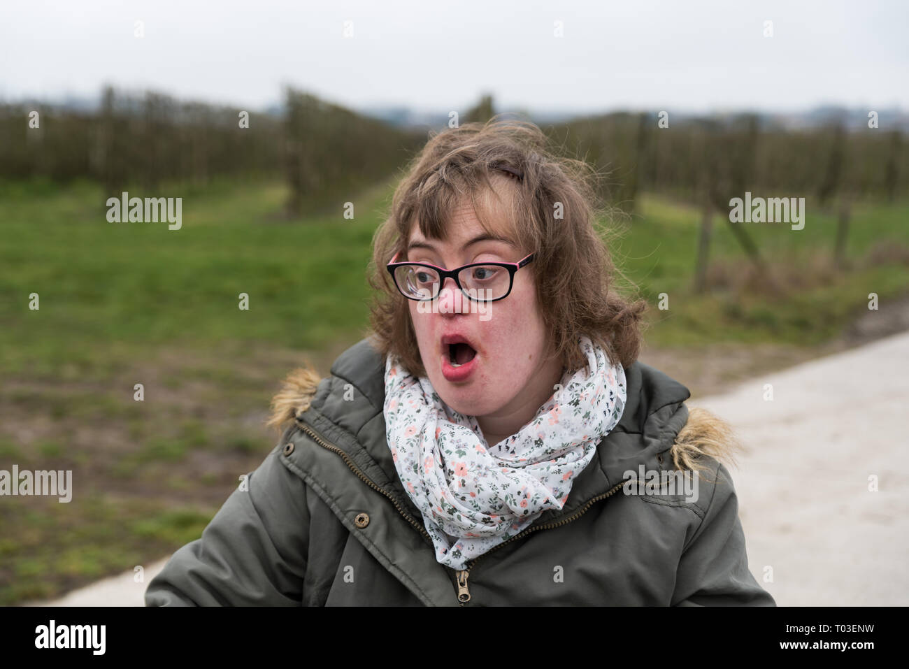 Hakendover, Flanders / Belgium - 03 02 2019: Portrait of a happy white woman with Down Syndrome and myopia Stock Photo