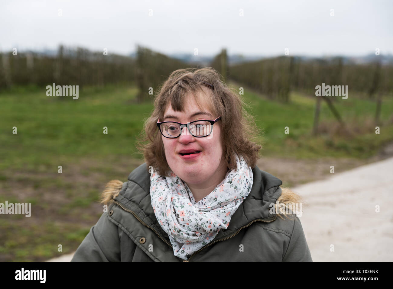 Hakendover, Flanders / Belgium - 03 02 2019: Portrait of a happy white woman with Down Syndrome and myopia Stock Photo