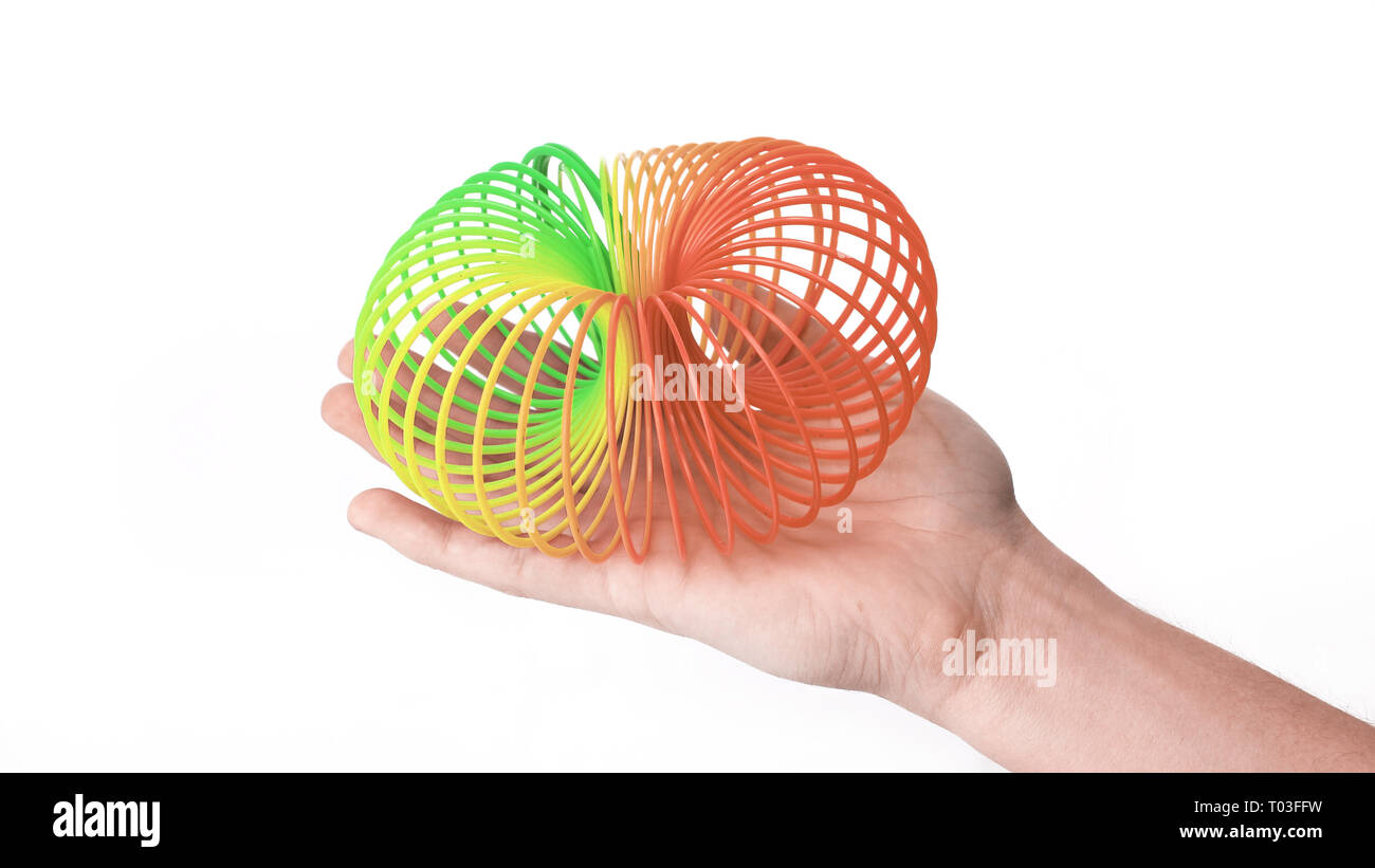 hands stretched rainbow spiral. toy from childhood Stock Photo Alamy