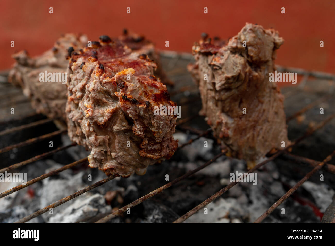 Cooking on artisanal grill a roast beaf. Meat for luhnc. Stock Photo