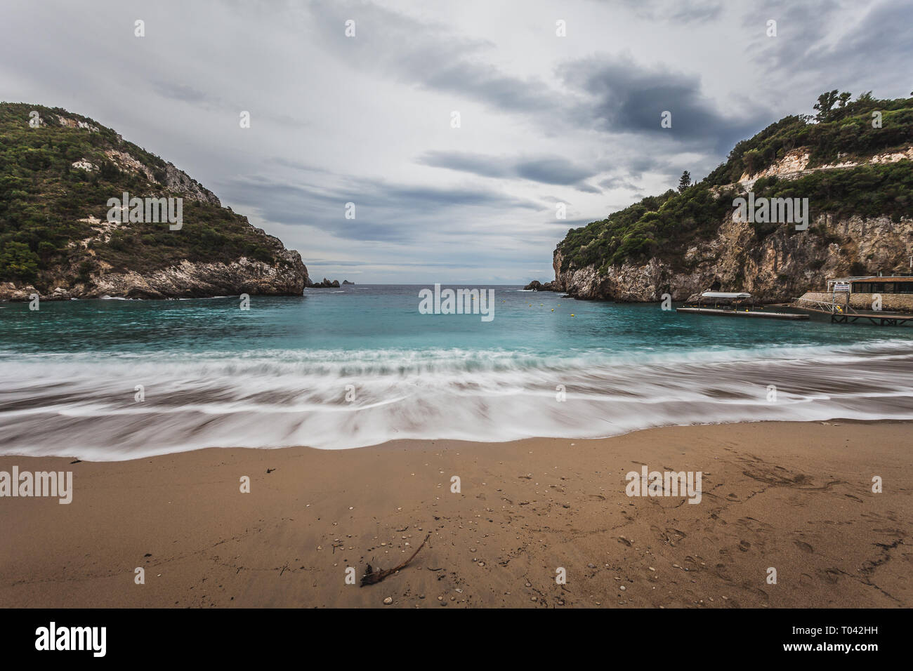 Paleokastritsa beach with Kolyviri island background on a rainy day, Corfu Island, Greece Stock Photo