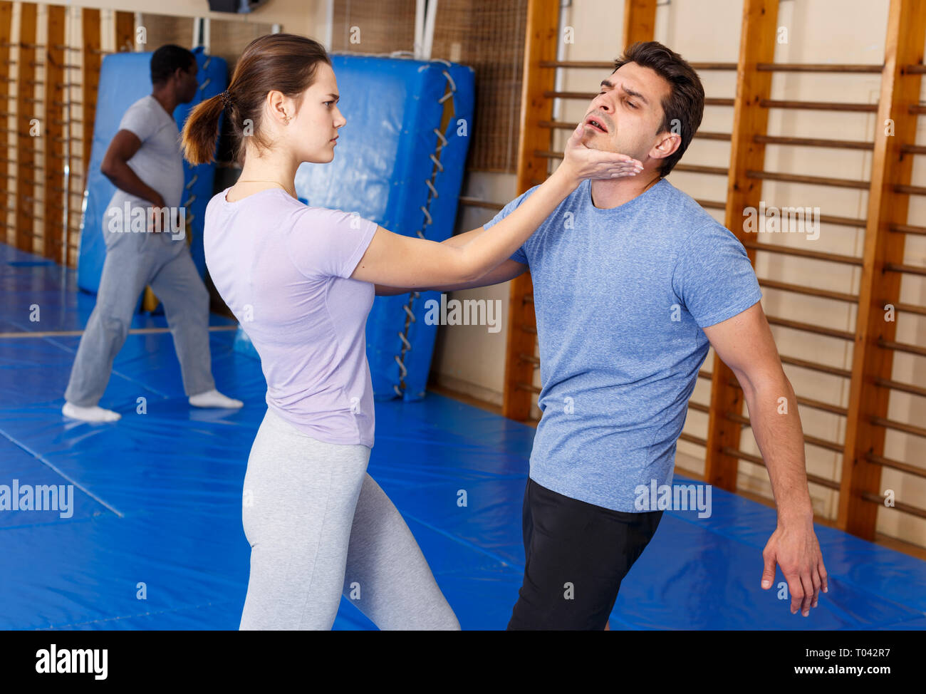 Adult people practicing effective techniques of selfdefence in