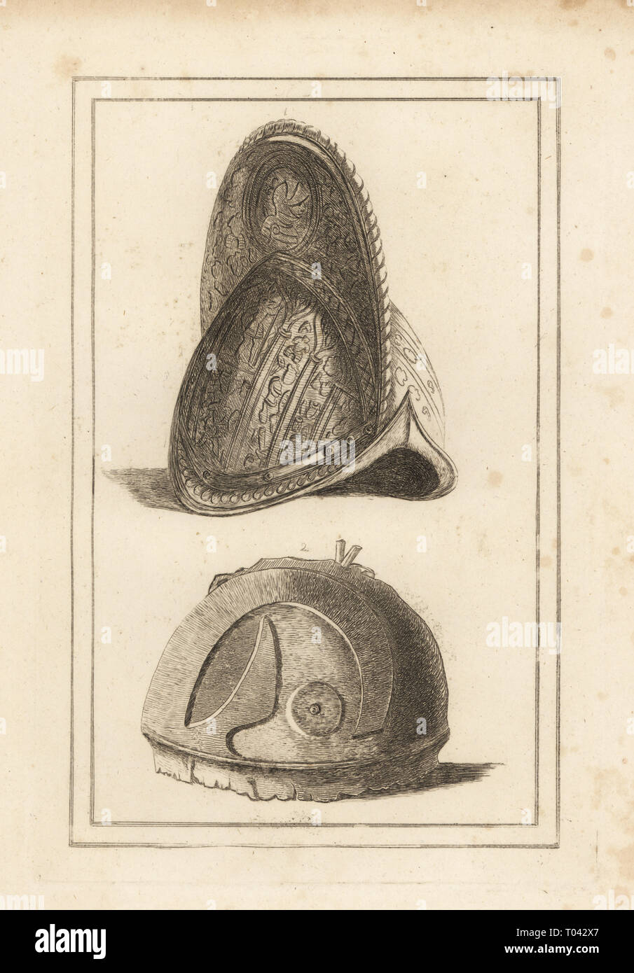 Ancient Venetian morion helmet ornamented with military trophies, and an ancient Roman helmet found at Cannae. Copperplate engraving from Francis Grose's Military Antiquities respecting a History of the English Army, Stockdale, London, 1812. Stock Photo