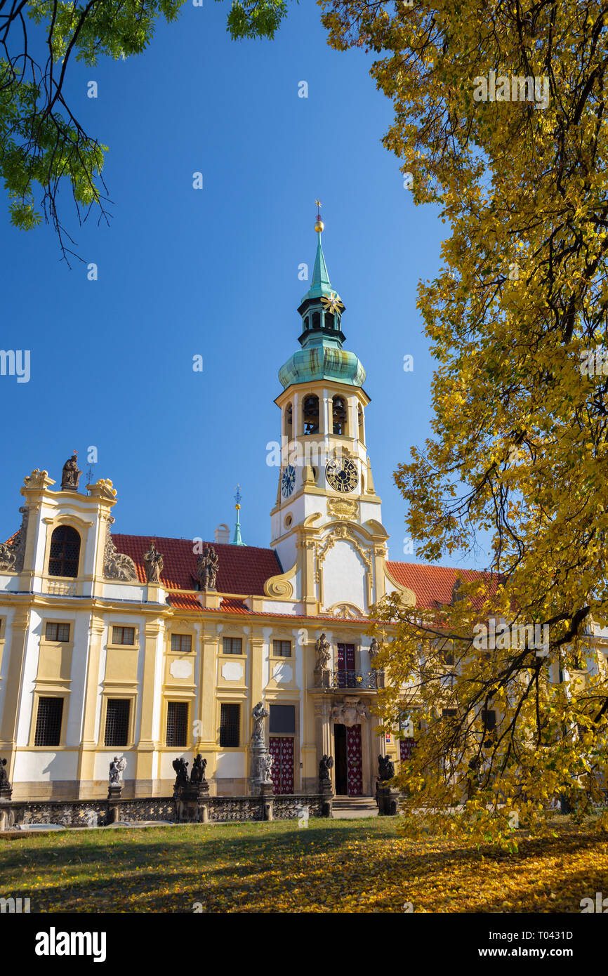 Prague - The Loreto baroque church and autumn tree. Stock Photo