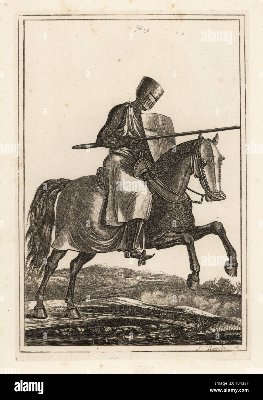 Charging knight of the 12th and 13th century in chainmail hawberk, flat helmet, lance, heater shield, shin armour jambesons, war saddle. Copperplate engraving by J. Hamilton from Francis Grose's Military Antiquities respecting a History of the English Army, Stockdale, London, 1812. Stock Photo