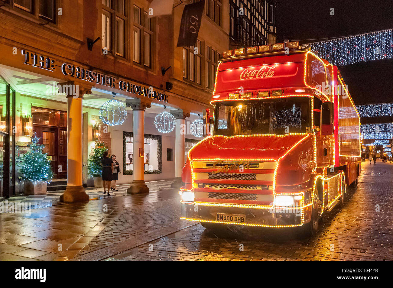 Coca Cola illuminated christmas truck in Chester. Stock Photo