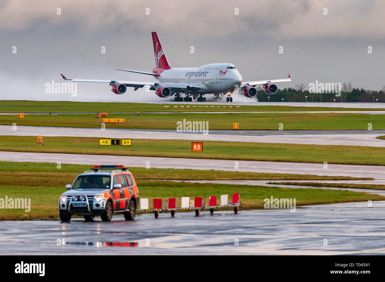 Boeing 747- 400 jumbo takes off at Manchester airport in the rain. Stock Photo