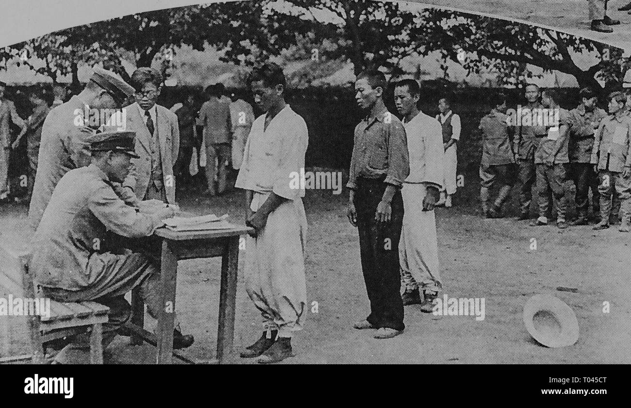 Recruitment of Korean worker during under Japanese rule, South Gyeongsang Province, c 1940. Issuance of visas by police, Private Collection Stock Photo