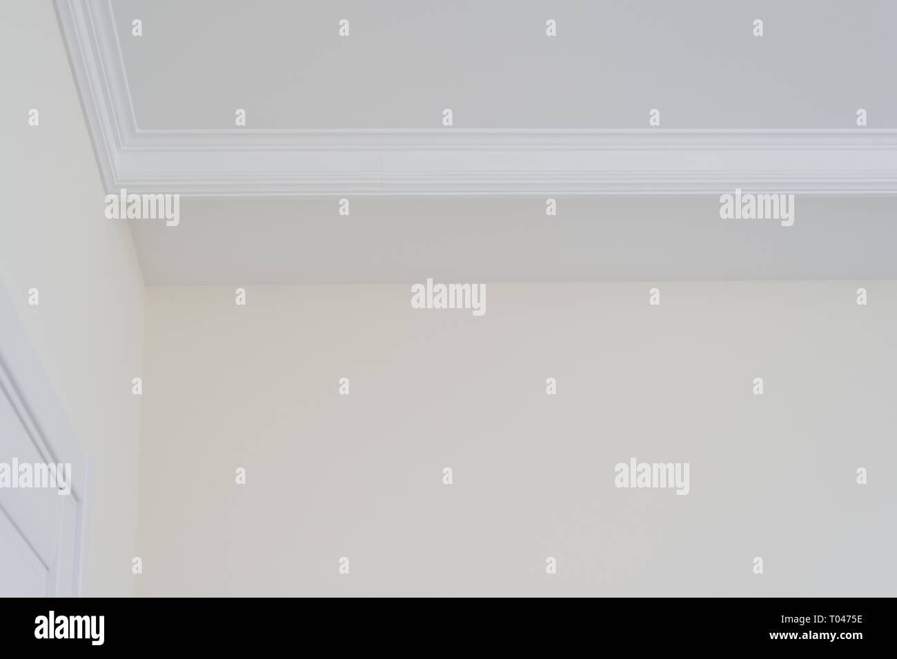White Decorative Ceiling Molding Detail In The Corner
