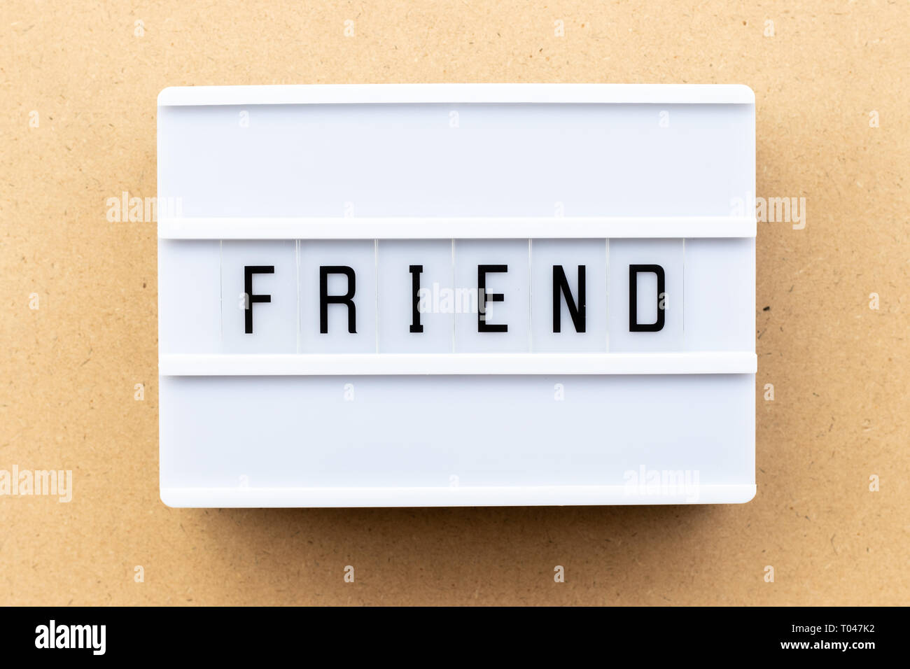 Light box with word friend on wood background Stock Photo
