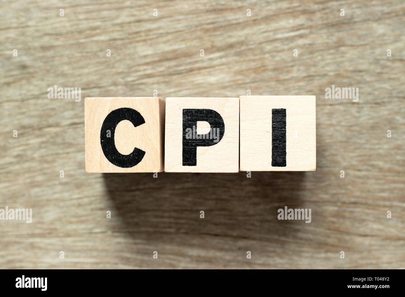 Letter block in word CPI (abbreviation of consumer price index) on wood