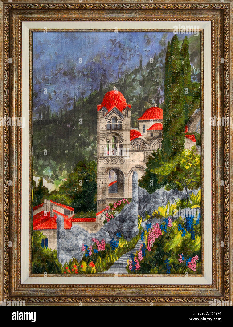 The monastery with cypresses against the background of mountains. Cross
