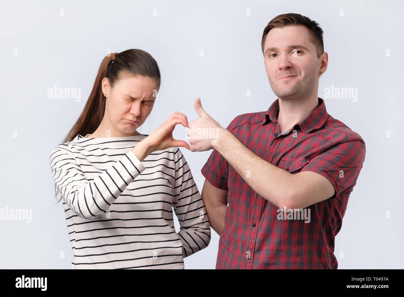 Friends aman and woman making friendzone symbol Stock Photo