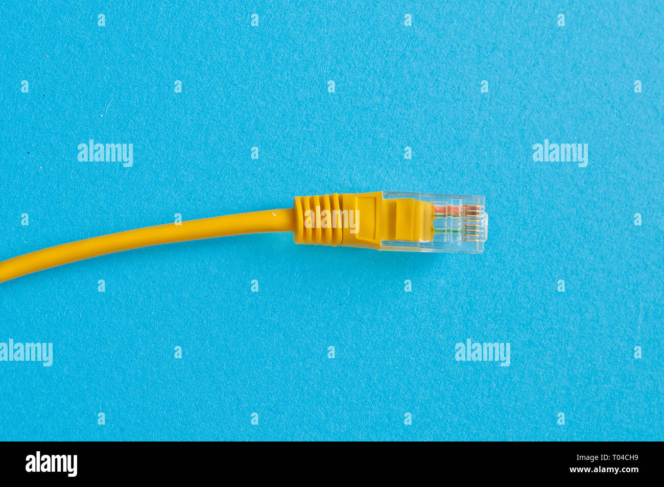 yellow cable on blue background Stock Photo Alamy