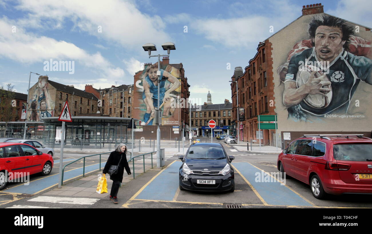 Partick bus station Glasgow, Scotland, UK  street scene shopping  with Commonwealth games rugby, netball and hockey graphics Stock Photo