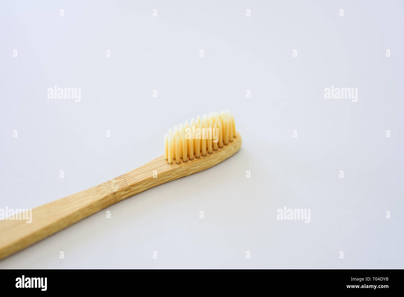 Wooden bamboo toothbrush close-up on grey background Stock Photo - Alamy
