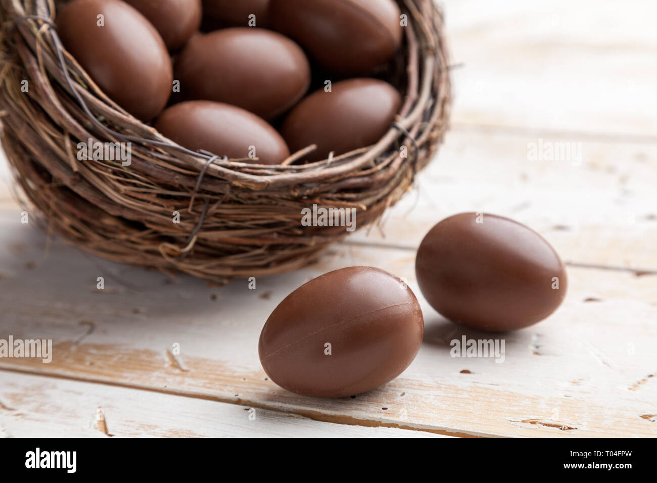 Delicious chocolate Easter holiday egg on rustic background Stock Photo