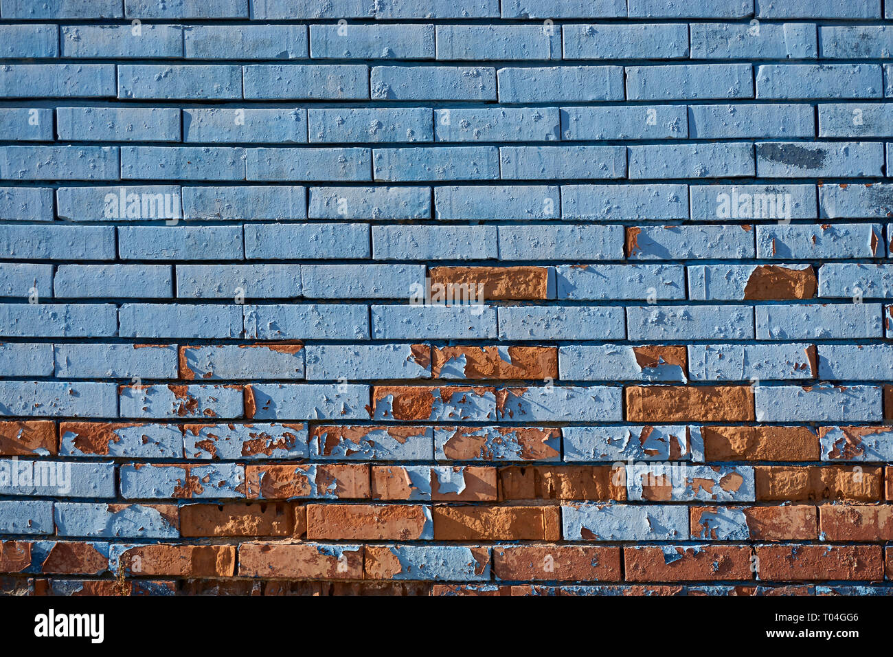 Old blue brick wall with flaking paint Stock Photo Alamy