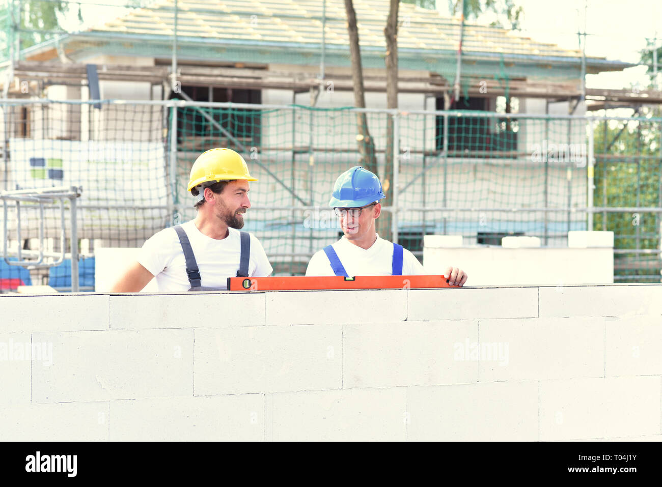 Construction workers build house hires stock photography and images