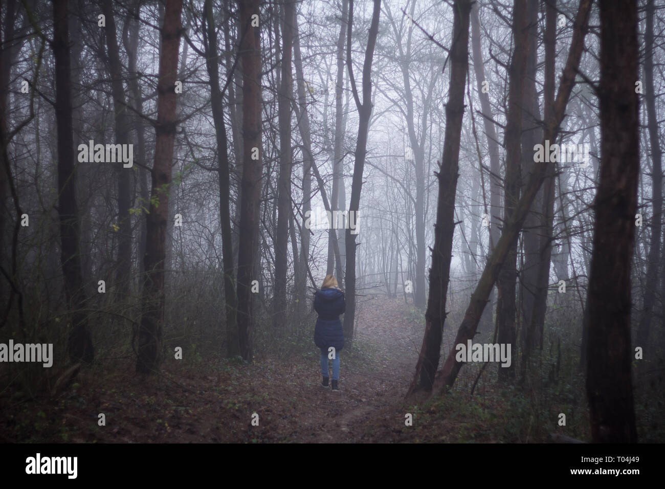 Woman walking alone hi-res stock photography and images - Alamy