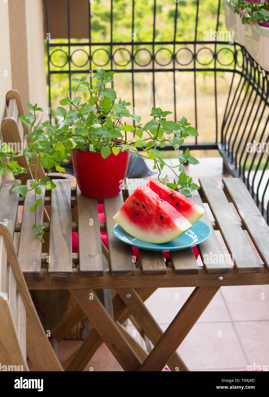 Sliced watermelon on wooden table outdoor Stock Photo