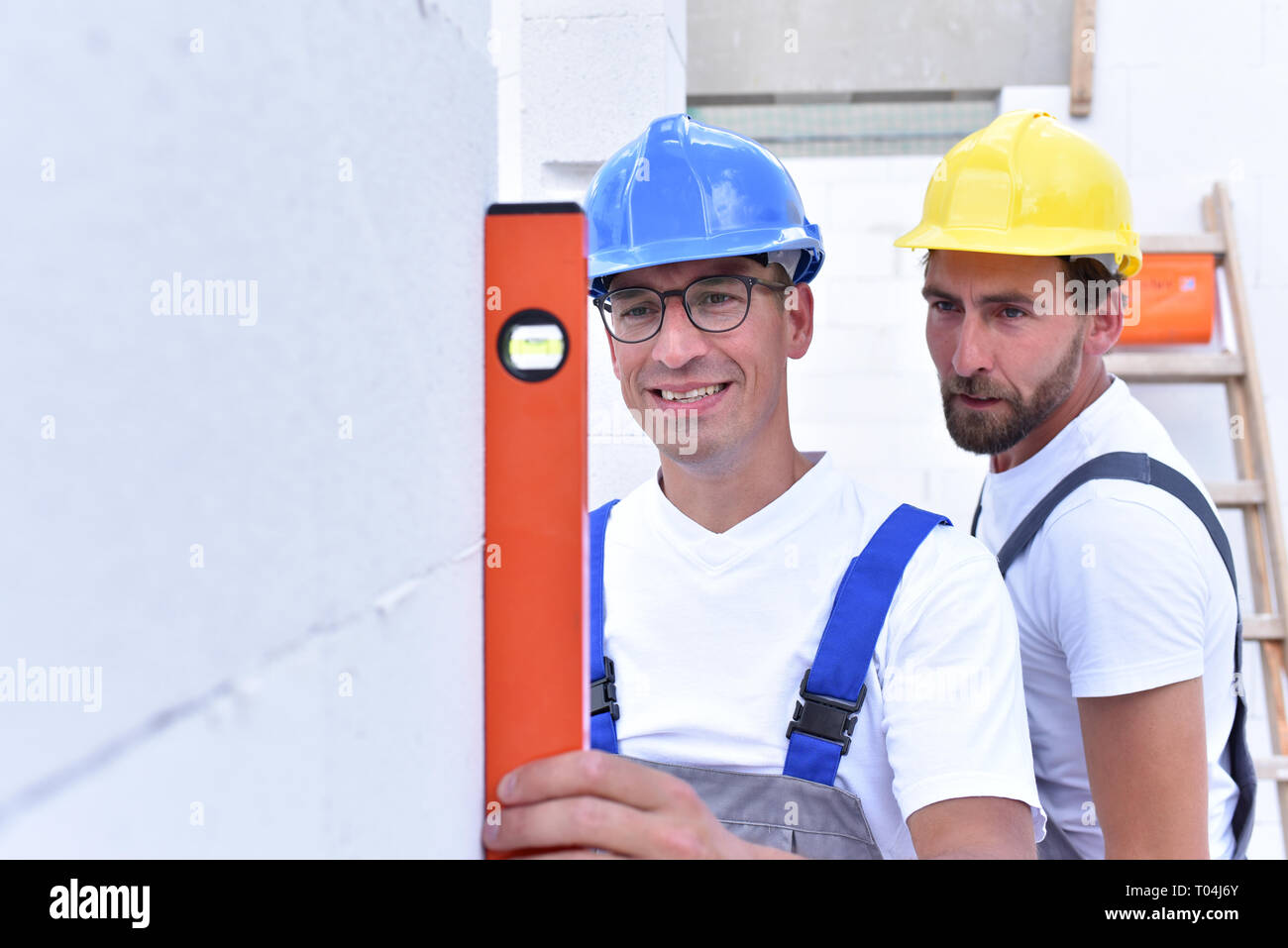 Construction workers build house hires stock photography and images