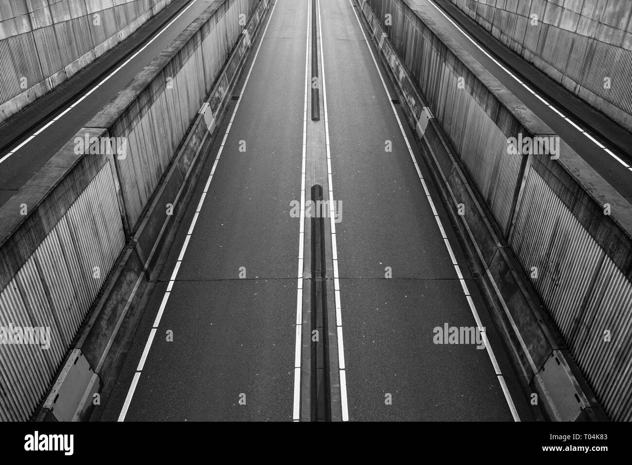 Empty roads leading in and out of a tunnel downtown to control traffic