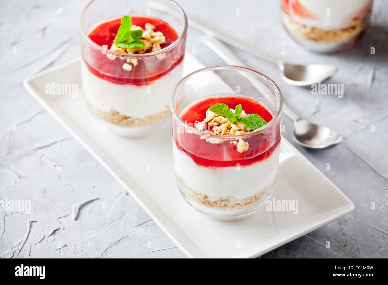 Couple of glasses of homemade strawberry cheesecake Stock Photo