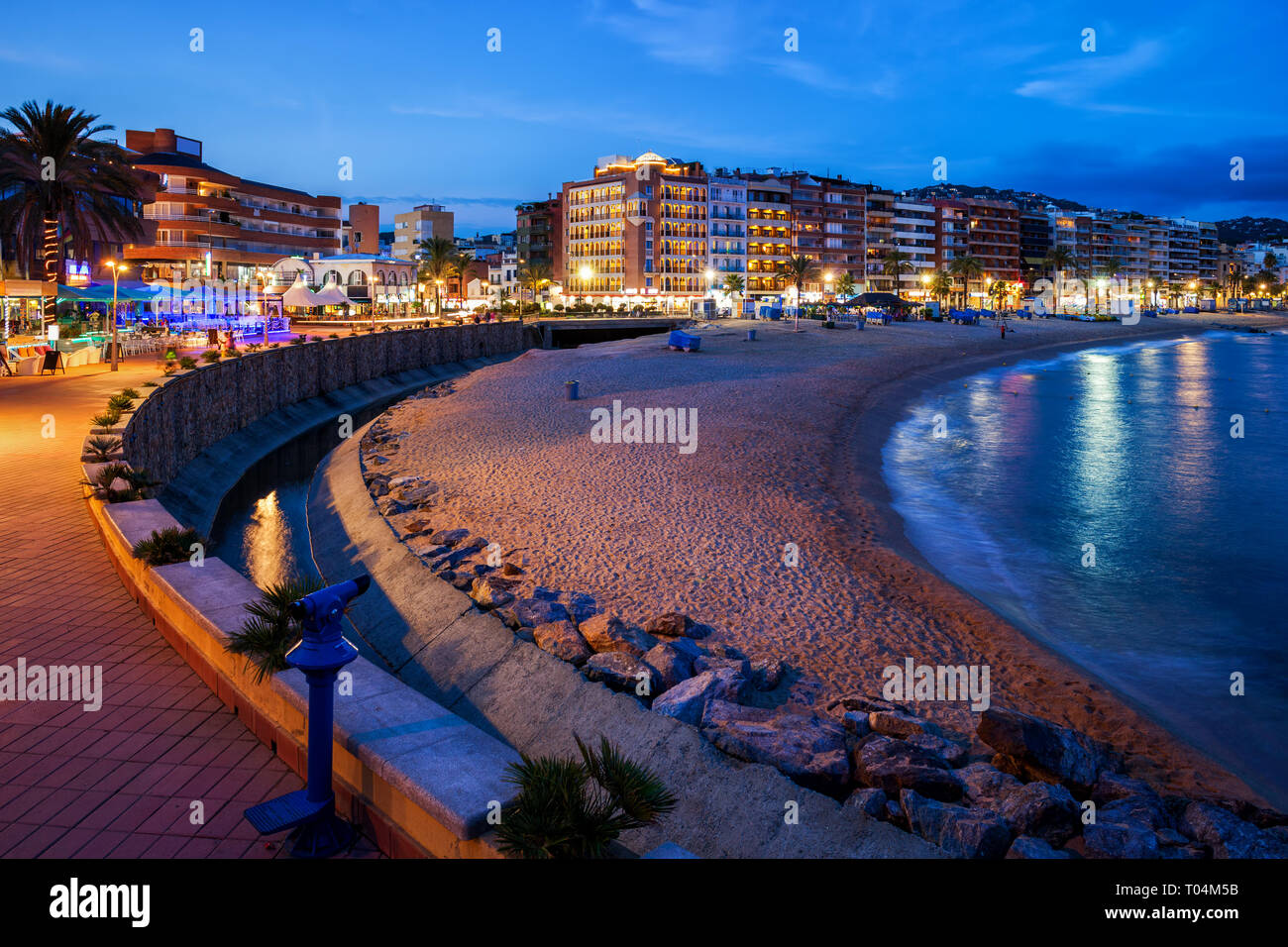 Resort town of Lloret de Mar at night in Catalonia, Spain, beach on Costa Brava at Mediterranean
