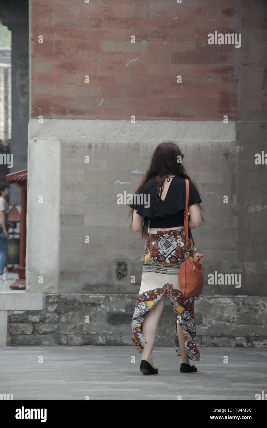 Woman long skirt walking away hi-res stock photography and images - Alamy