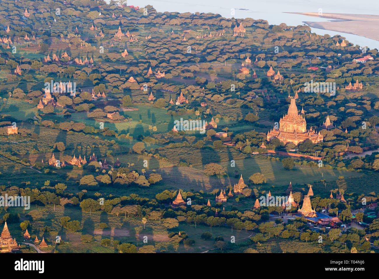 Aerial view of temples and historical pagodas of the Archaeological Zone in Bagan in the early morning sunlight. Myanmar (Burma). Stock Photo