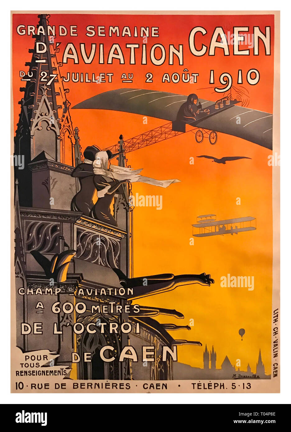 1910 SEMAINE D’AVIATION, CAEN by Dessoures Midsummer, 1910, and nothing is better than watching those Magnificent Men in their Flying Machines from the top of the Église St-Pierre, in Caen. Over 60,000 spectators a day took in the spectacle (though few from this vantage point), which included “competitive events between ‘civilians’ and ‘servicemen'” (Affiches d’Aviation, p. 57) in hot-air balloons and rudimentary flyers in the infancy of the aviators’ age. Stock Photo