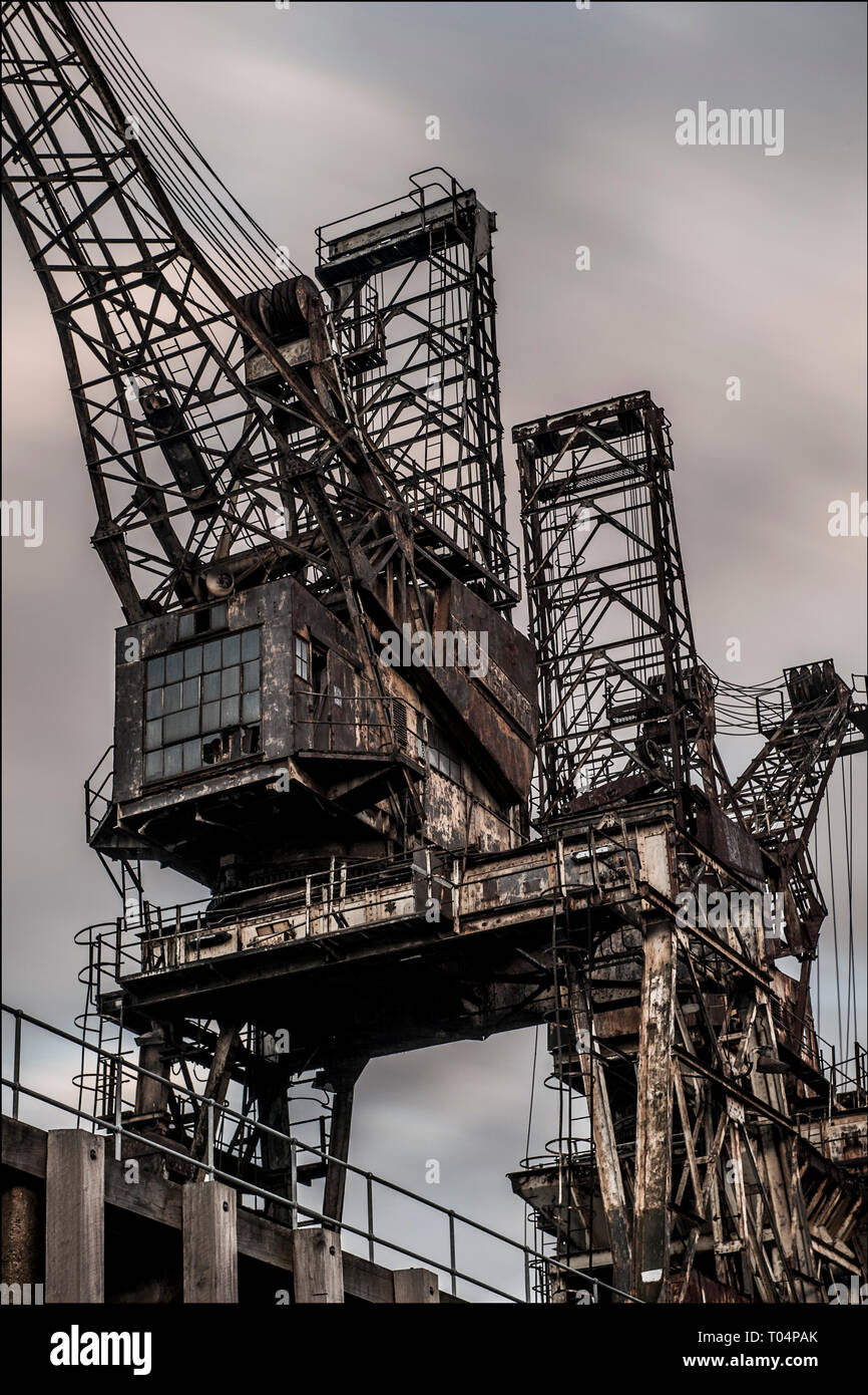 Rusty cranes outside Battersea Power Station prior to renovation Stock Photo