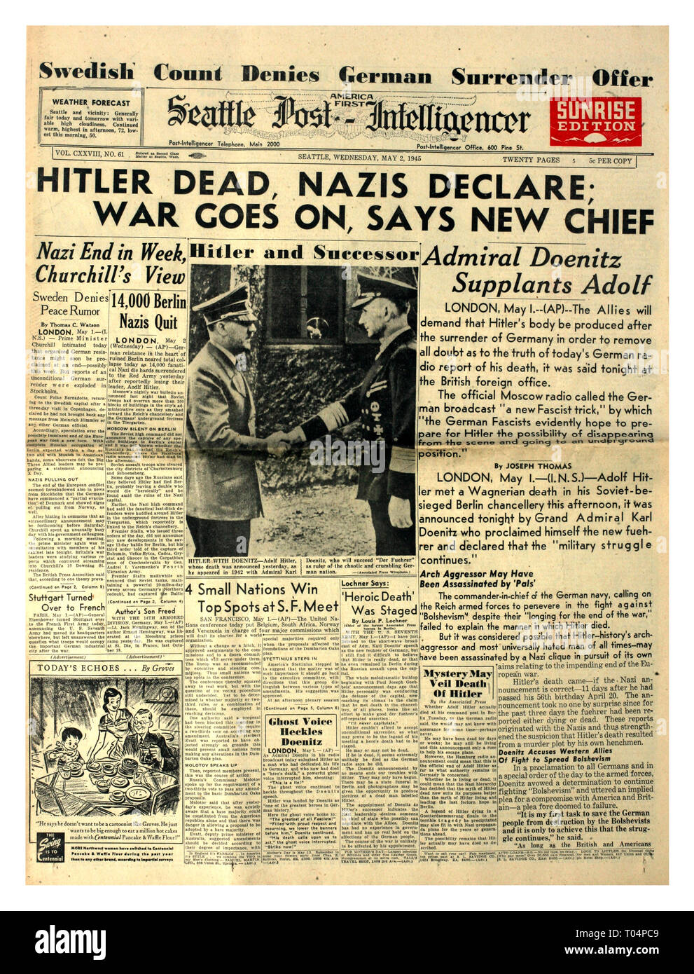 'HITLER DEAD NAZIS DECLARE WAR GOES ON' May 2nd 1945 Seattle Post (America First) Intelligencer newspaper headline WW2 Hitler shown shaking hands with his successor Admiral Doenitz World War II Stock Photo