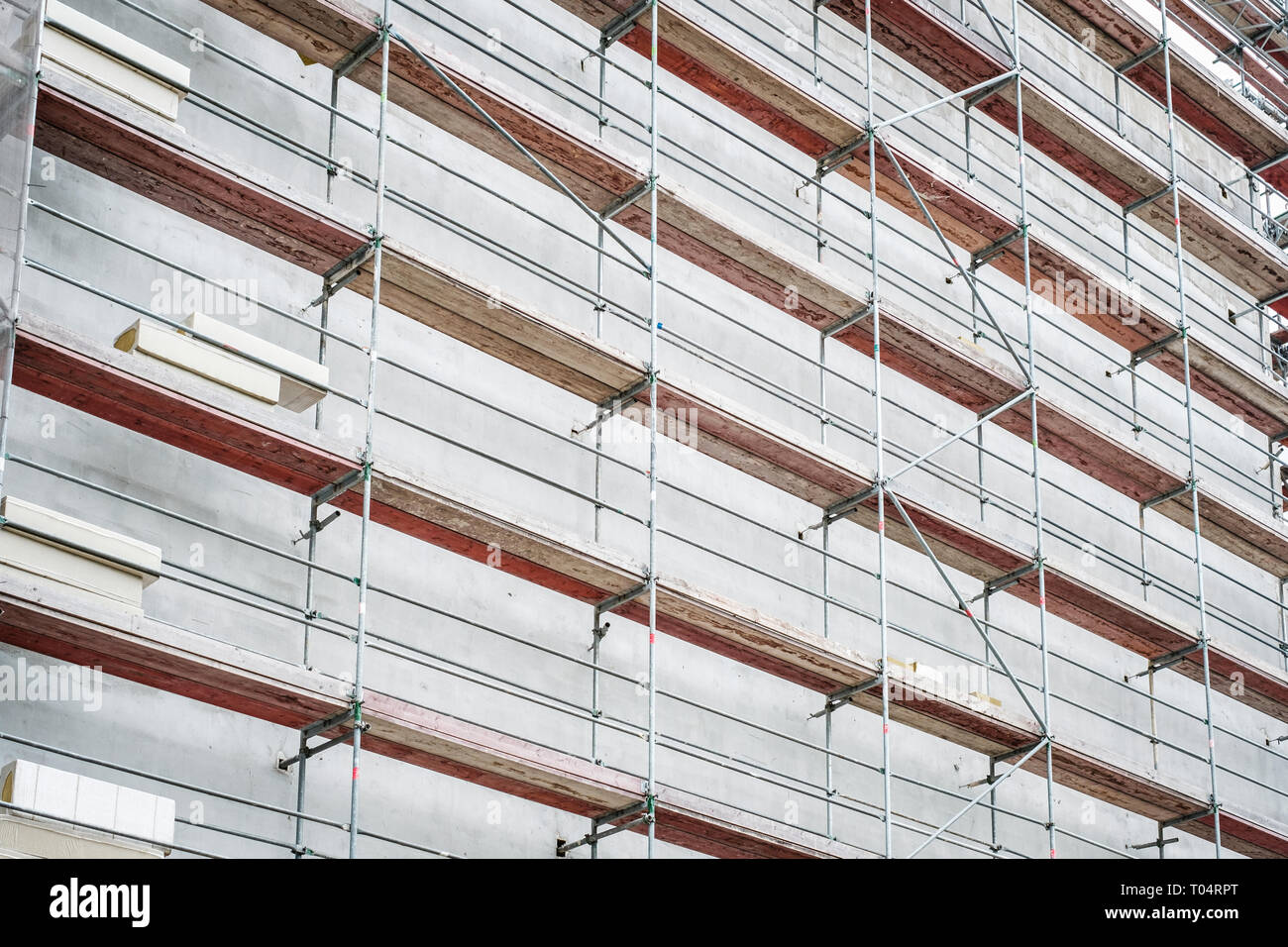 Scaffolding On House Facade Apartment Building Under Construction