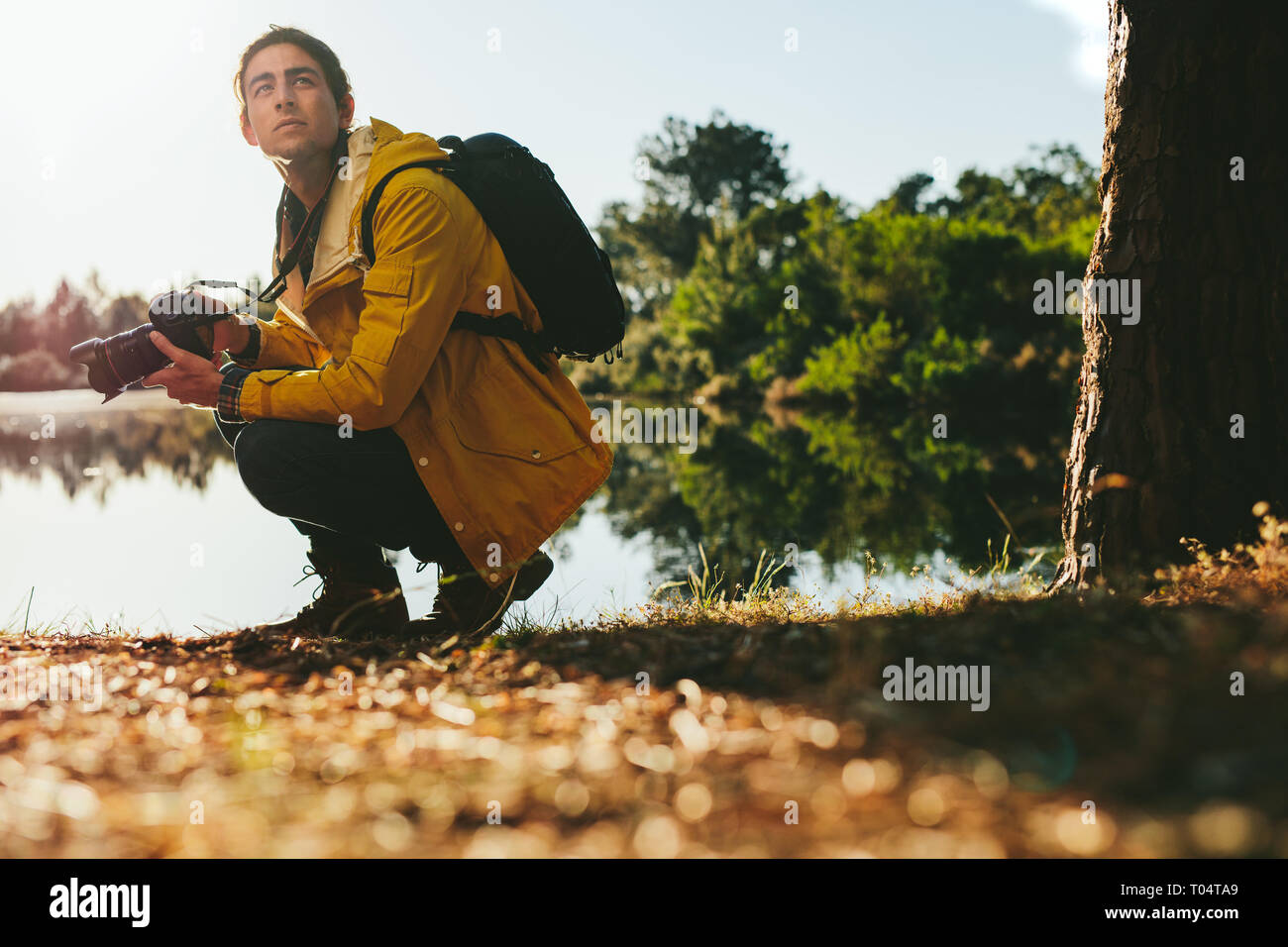 traveler looking around to capture the beauty of nature in camera ...