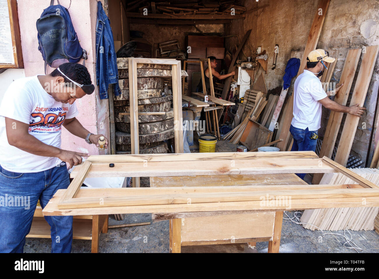 Cartagena Colombia,Center,centre,Getsemani,Hispanic resident residents,man men male,working carpenter building door,Plazuela de Pozo,COL190120011 Stock Photo